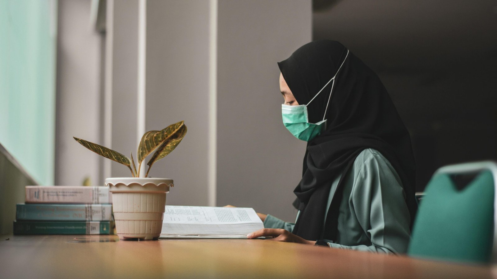 Muslim NHS nurse wearing hijab during a night shift, representing the marriage challenges faced by Muslim healthcare professionals in the UK