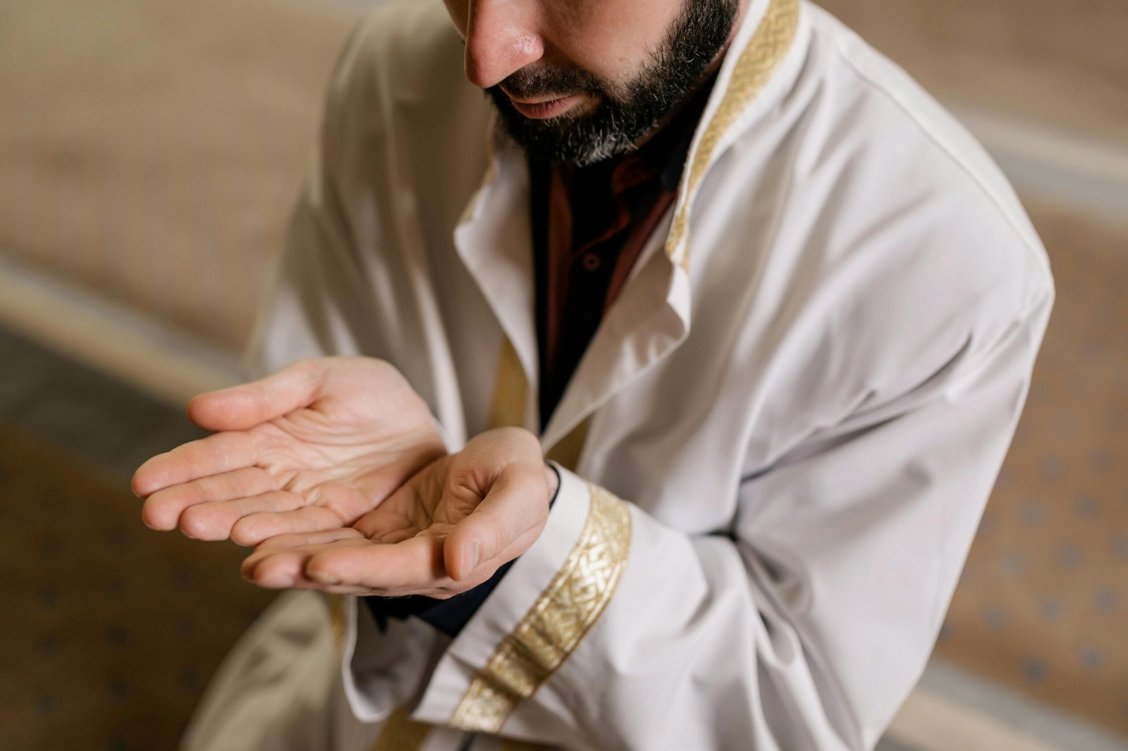 Muslim man making dua with open hands seeking a righteous spouse in Islam