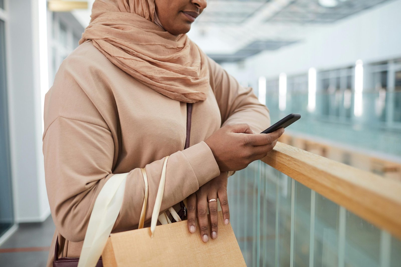 Hijabi using islmaic matrimonial site in public on her smartphone