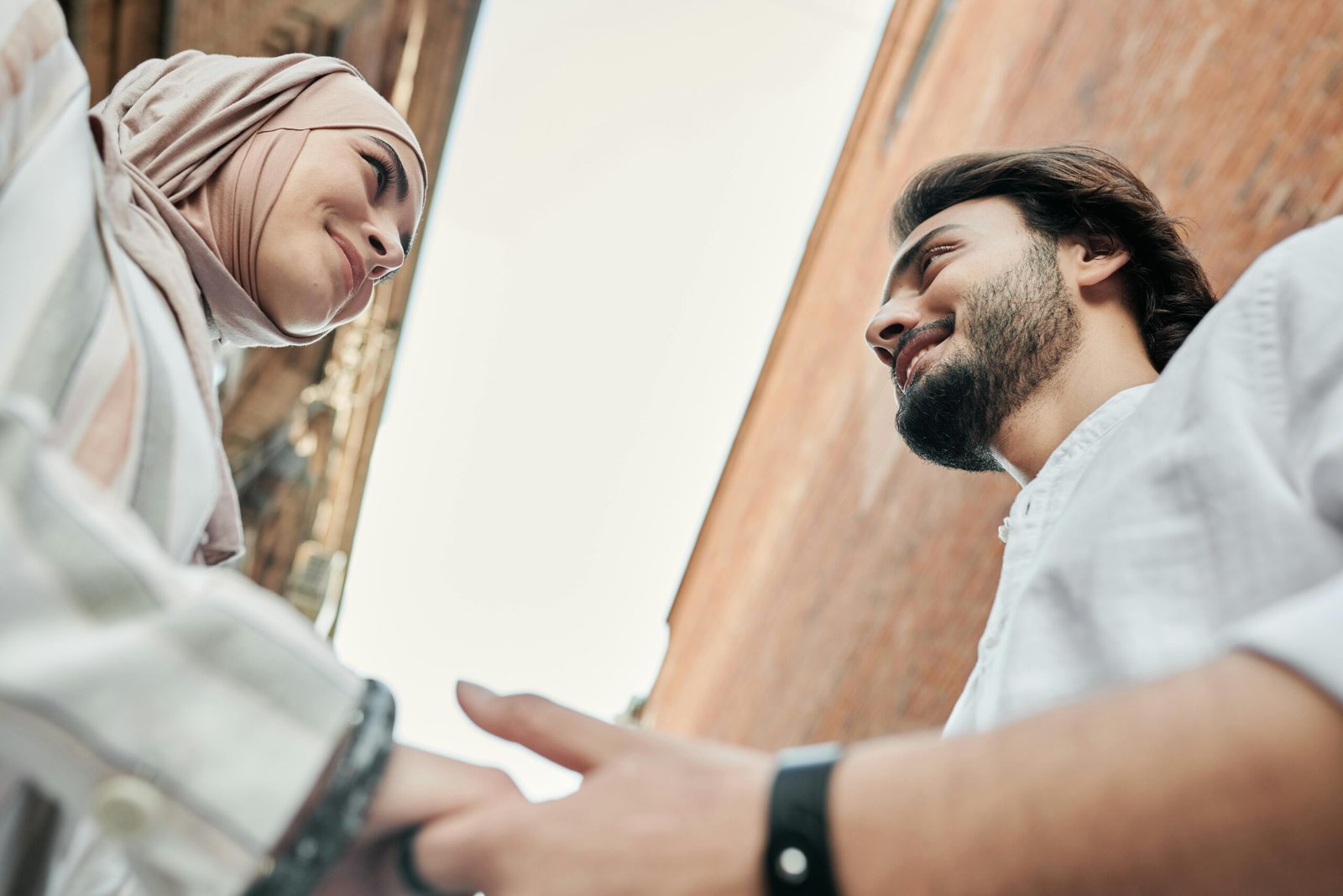 Muslim couple holding hands